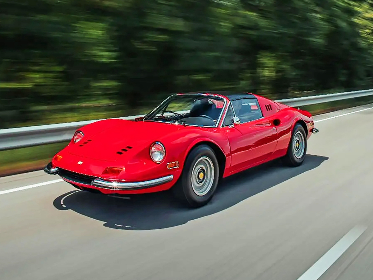 Red Ferrari Dino 246 GTS on road